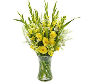 Sunny Splendor: Yellow Gladiolus in a Glass Vase