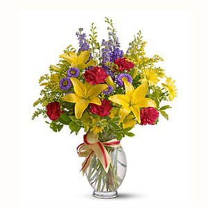 Global Blooms: Imported Mix Flowers Presented in a Stylish Vase