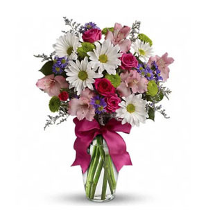Global Blooms: Imported Mix Flowers Presented in a Stylish Vase